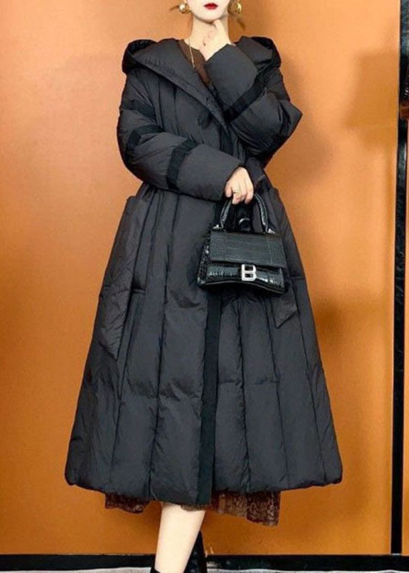 Bohemian Schwarze Pufferjacke Mit Übergroßen Taschen Für Entendaunen Im Winter